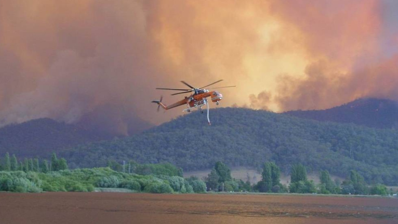 Erricson Sky crane fills up from a lake near Bairnsdale, at the height of the Gippsland fires in late December. Picture: Michael Douthat