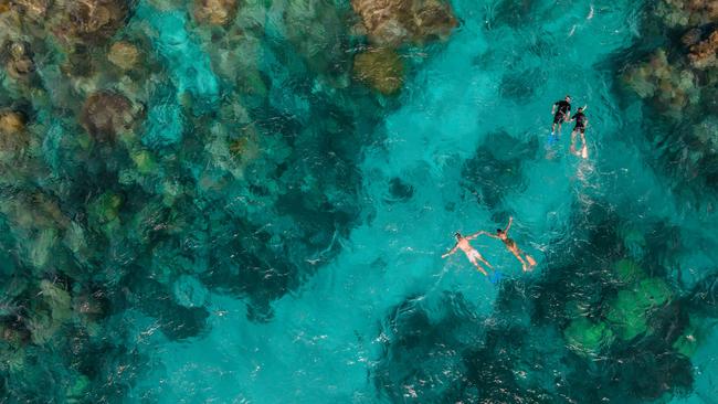 A woman in her 20s scuba diving at Norman Reef has been airlifted to Cairns Hospital.