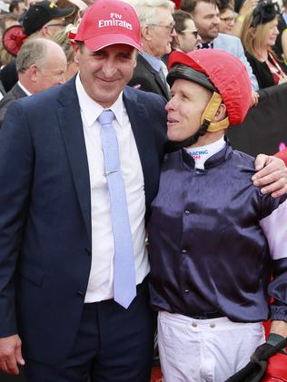 Winning jockey Kerrin McEvoy (right) with trainer Robert Hickmott at the Melbounre Cup.