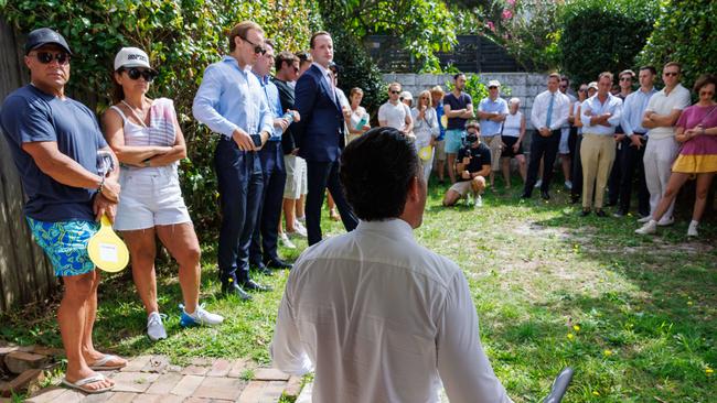 Auctioneer James Hayashi calls bids for the Bronte home. Picture: Justin Lloyd.