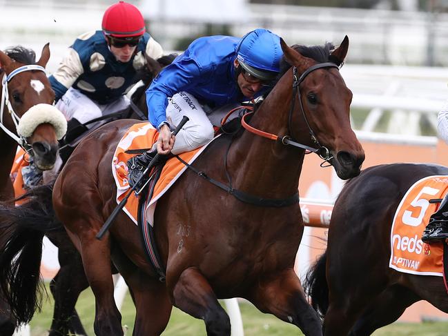 MELBOURNE. 09/10/2021. Horse Racing. Caulfield Guineas day at Caulfield racecourse, Melbourne. Race 8. The Caulfield Guineas.  Anamoe ridden by Damien Oliver (blue colours) heads to the line ahead of Captivant to win the Caulfield Guineas    . Photo by Michael Klein