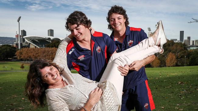 You’re the best, Mum: Cricketing brothers Thomas and Corey Kelly show their ‘number one supporter’ a bit of love. Picture: Sarah Reed