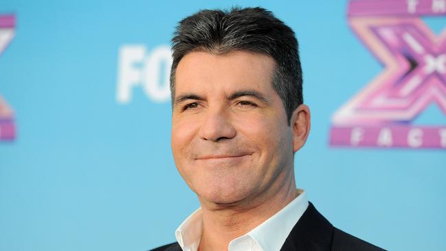 Simon Cowell was shocked by his appearance from before his weight loss. Picture: Jordan Strauss/Invision/AP