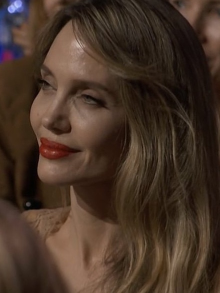 Angelina Jolie was stone-faced when cameras flashed to her.