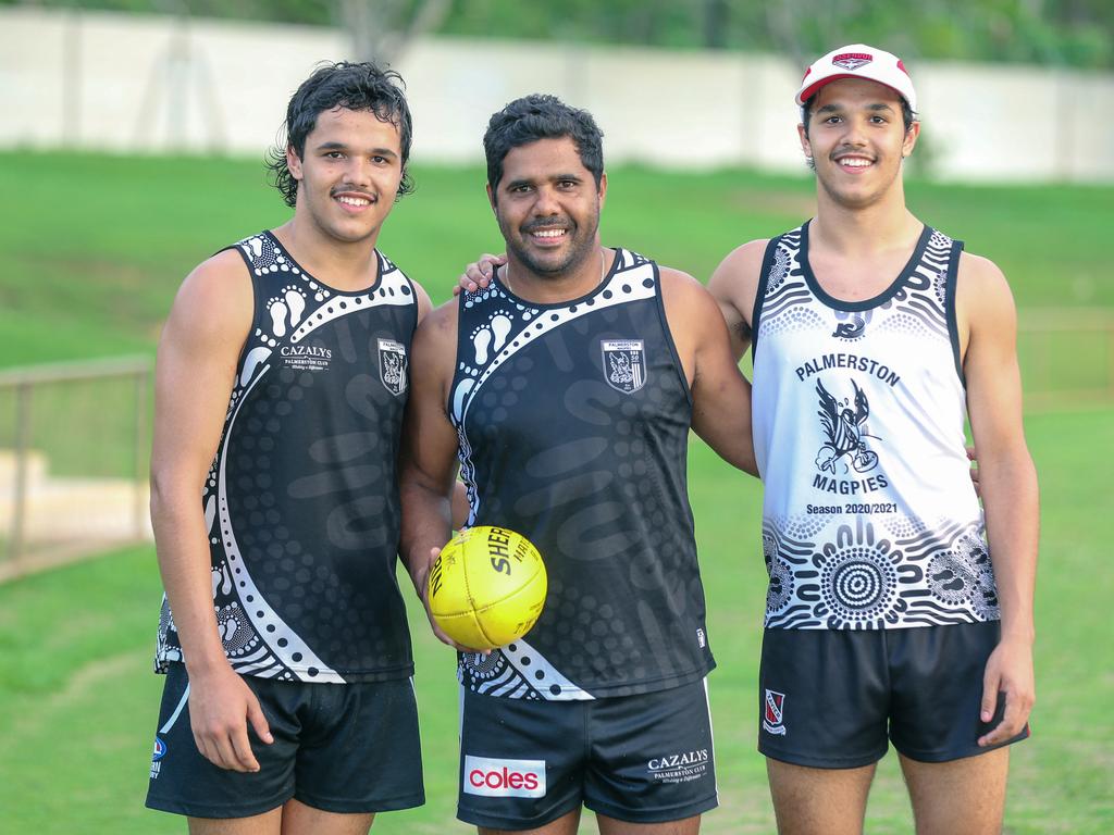 Alwyn Davey and his twin sons Alwyn Jr (right) and Jayden at Cazalys Oval. Picture: Glenn Campbell.