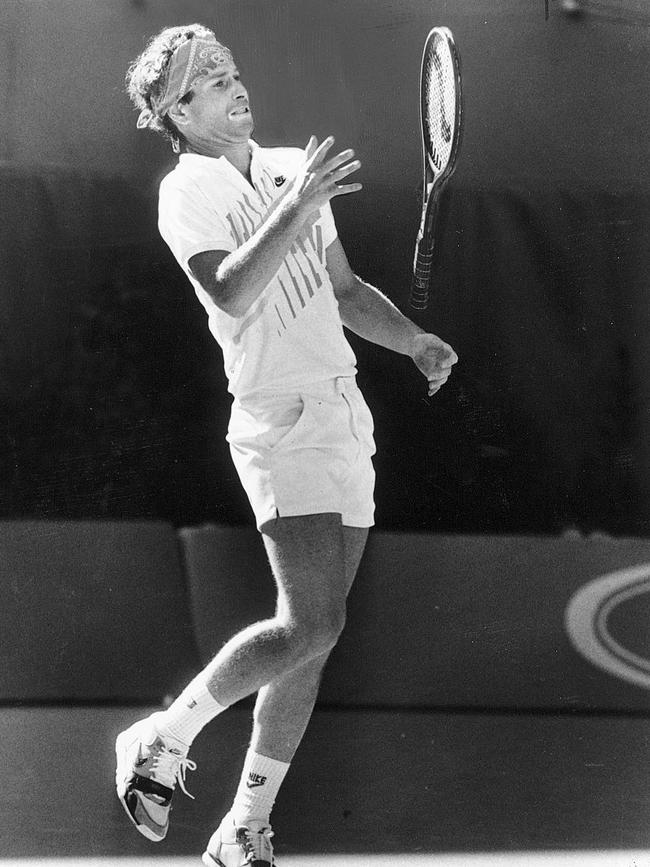 John McEnroe's racquet flies back towards him after he threw it to the ground in disgust after missing a vital point in the 1990 Australian Open, before he was disqualified for misconduct.