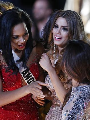 In tears ... other contestants comfort Miss Colombia Ariadna Gutierrez. Picture: AP