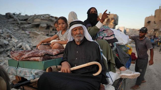 Displaced Palestinians leave Khan Younis area. Picture: AFP