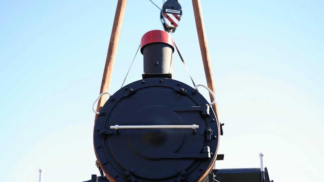 The C17 Locomotive No. 967 is lowered on to the tracks at Old Gympie Railway Station. Picture: Leeroy Todd