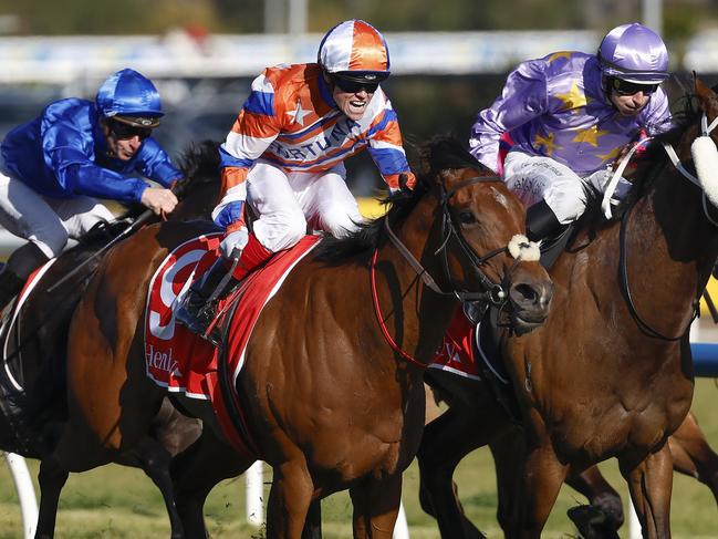 NCA. MELBOURNE, AUSTRALIA. October 12 , 2024. RACING. Caulfield Guineas race day at Caulfield Racecourse  .  Race 9. The Schillaci Stakes.  Craig Williams (orange and white cap) urges Bellatrix Star on as he charges to the post to win race 9  .  Pic : Michael Klein