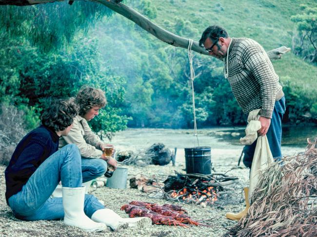 John McCuaig, Ed Glover and Rex Strong cooking crayfish at Schooner Cove in 1976. The image features in Peter Marmion's new book Hidden Worlds. Picture: Peter Marmion