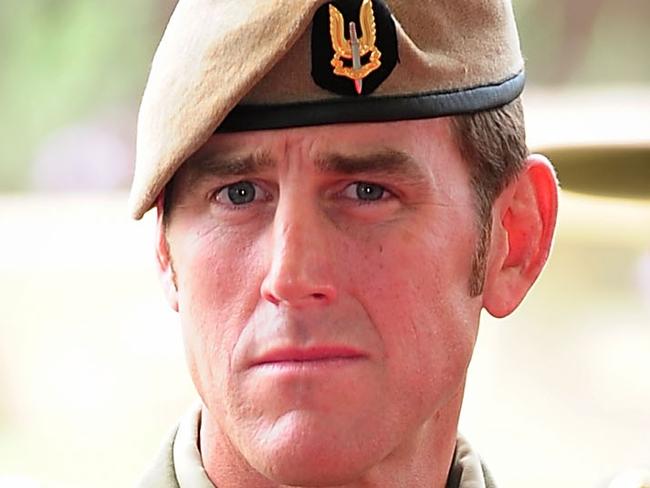 Australian Army soldier Corporal Benjamin Roberts-Smith, VC, MG, takes a seat after being awarded the Victoria Cross for Australia during the investiture ceremony in Perth on 23 January 2011. *** Local Caption *** The Governor-General of the Commonwealth of Australia held an investiture ceremony at Campbell Barracks in Perth to award a Victoria Cross for Australia to Corporal Benjamin Roberts-Smith, VC, MG, on 23 January 2011.  Corporal Benjamin Roberts-Smith, VC, MG, from the Special Air Service Regiment was awarded the Victoria Cross for Australia for his gallantry under fire during operations in Afghanistan in June 2010.    Present at the ceremony were the Governor-General of the Commonwealth of Australia, Her Excellency Ms Quentin Bryce AC; Prime Minister of Australia the Hon. Julia Gillard MP; Leader of the Opposition the Hon. Tony Abbott MP; Minister for Defence the Hon. Stephen Smith MP; Minister for Defence Science and Personnel the Hon Warren Snowdon MP; Governor of Western Australia, His Excellency Dr Ken Michael AC; Premier of Western Australia the Hon. Colin Barnett MLA; Ambassador of the Islamic Republic of Afghanistan, his Excellency Dr Amanullah Jayhoon; Member for Curtin the Hon. Julie Bishop MP; Chief of the Defence Force, Air Chief Marshal Angus Houston AC AFC; Chief of Army, Lieutenant General Ken Gillespie AO DSC CSM; and Special Operations Commander Australia, Major General Gus Gilmore DSC.  The Victoria Cross for Australia is our highest honour. It is only awarded to those who display the most conspicuous gallantry and daring in the face of the enemy. Corporal Benjamin Roberts-Smith, VC, MG, becomes the 98th Australian recipient of the award and the second recipient of the Victoria Cross for Australia since it was instituted in 1991. Picture: Department of Defence