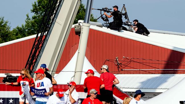 Law enforcement agents and members of the audience react after hearing gunshots. Picture: Eric Lee/The New York Times)