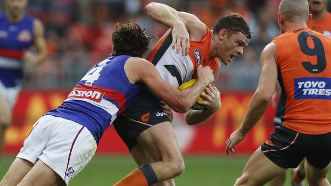 Heath Shaw is tackled by Marcus Bontempelli in Round 9 at Spotless Stadium. Picture: Phil Hillyard