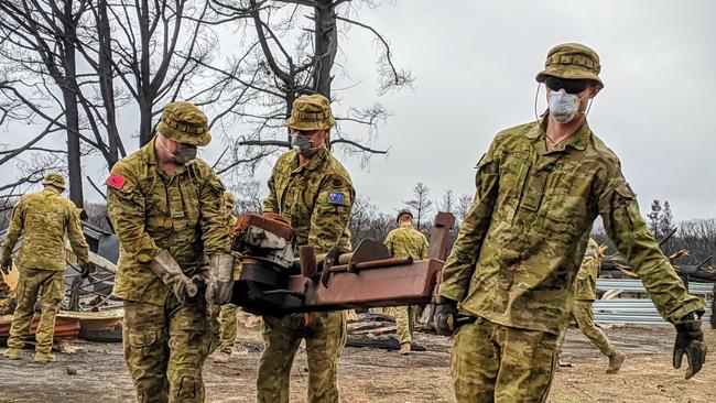 Australian Army soldiers from Joint Task Force 1111 clearing remains of a shearing shed on Kangaroo Island as apart of Operation Bushfire Assist.