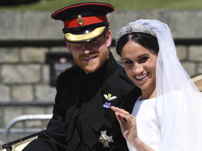 Harry and Megs on their big day, when Prince Charles gave her away. Picture: AP 