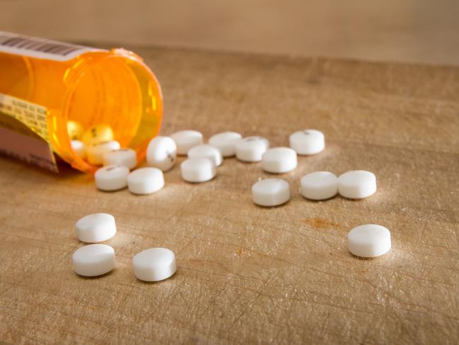 White pills spilled out over some wood  Picture: istock