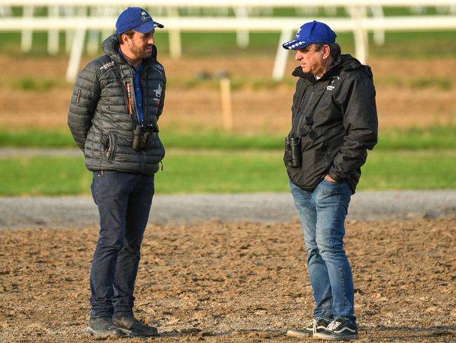 Trainers Levi Kavanagh and Mark Kavanagh are seen during a trackwork session at Flemington Racecourse in Melbourne, Friday, January 17, 2020. (AAP Image/Vince Caligiuri) NO ARCHIVING