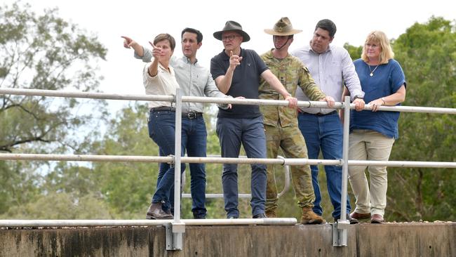 Emergency Management Jenny McAlister, Premier David Crisafulli, PM Anthony Albanese, Lieutenant Colonel Ryan Mitchell, Commanding Officer 3CER, Minister for Transport and Main Roads Brent Mickelberg on the rail bridge over the creek. Picture: Evan Morgan