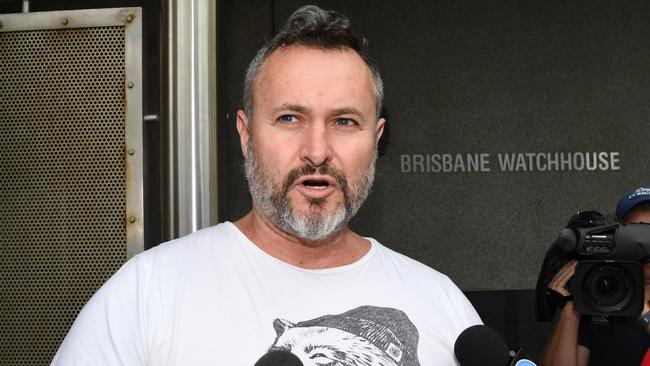 Criminal lawyer Adam Magill talks to the media as he comes out of the police watch house after he was granted bail.