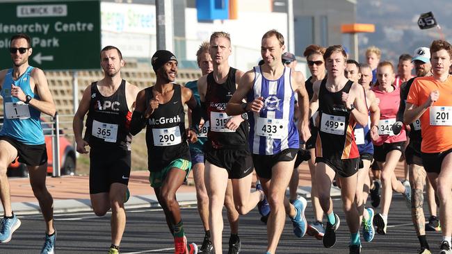 Dejen Gebreselassie (centre) at the start of the race. Picture: LUKE BOWDEN