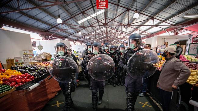 A heavy police presence is seen at the Queen Victoria Market in the depths of Melbourne’s Covid lockdown.