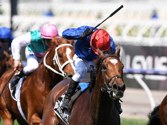 Jockey Kerrin McEvoy (centre) rides Cross Counter to victory in race 7 the Lexus Melbourne Cup, as part of the Melbourne Cup Carnival, at Flemington Racecourse in Melbourne, Tuesday, November 6, 2018. (AAP Image/Dan Himbrechts) NO ARCHIVING, EDITORIAL USE ONLY