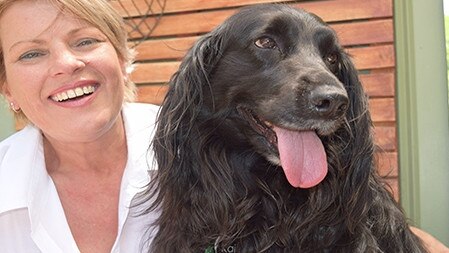 Paula Dickerson, from Onlead Force Free Dog Training, with her beloved rescue dog and training partner, Kai, flat coat retriever x cocker spaniel. Picture: supplied