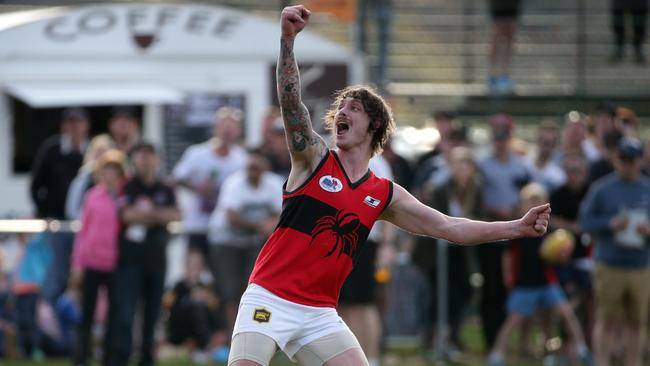 Romsey’s Cameron Dawson celebrates a goal on the three-quarter time siren. Picture: Mark Dadswell