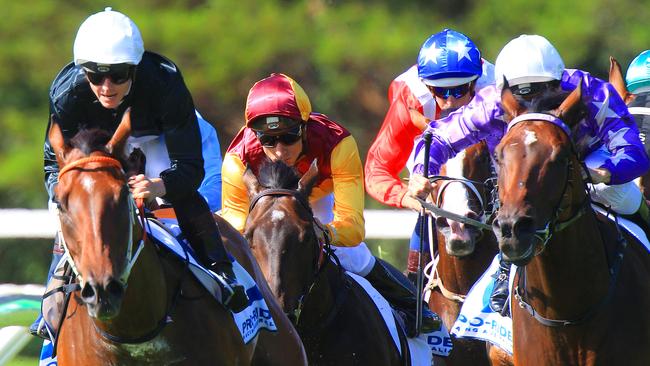 Jamie McDonald on Leebaz, left, at the home turn at Warwick Farm. Picture: Mark Evans