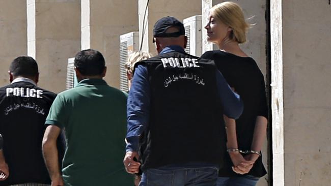 Police escort Australian Sally Faulkner, the mother of the al-Amin children, and Australian reporter Tara Brown, to Lebanon's Baabda Prison for women, after their trial was adjourned, Lebanon April 18, 2016. REUTERS/Mohamed Azakir