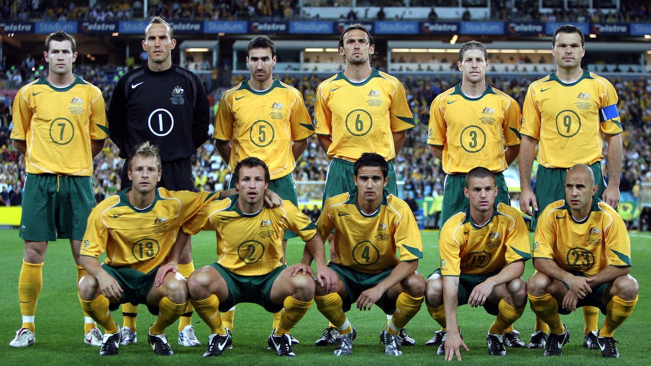 Mark Bresciano with his ‘second family’ lining up ahead of the Uruguay game in 2005. Most of the squad members from the time are still involved with the game in coaching, at a local level or in administration. Picture: George Salpigtidis/News Corp