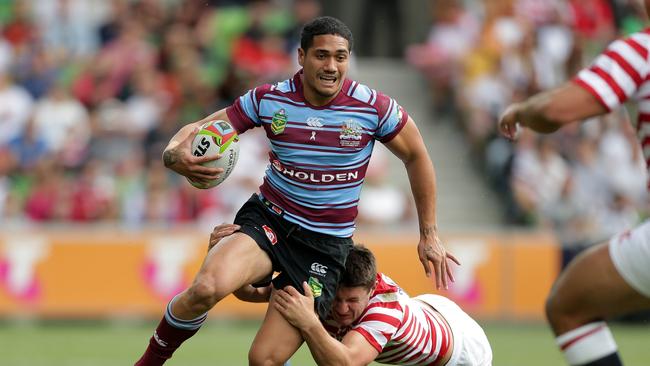 Sione Mata'utia of Australia is tackled during the Four Nations match between the Australian Kangaroos and England at AAMI Park. Picture: Mark Metcalfe/Getty Images)