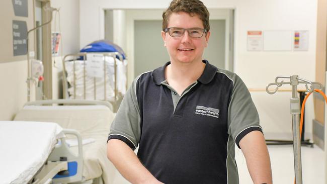 Shane Rixham, a Patient Services Assistant at Box Hill Hospital is working in the Emergency Department to help with COVID-19 patients.