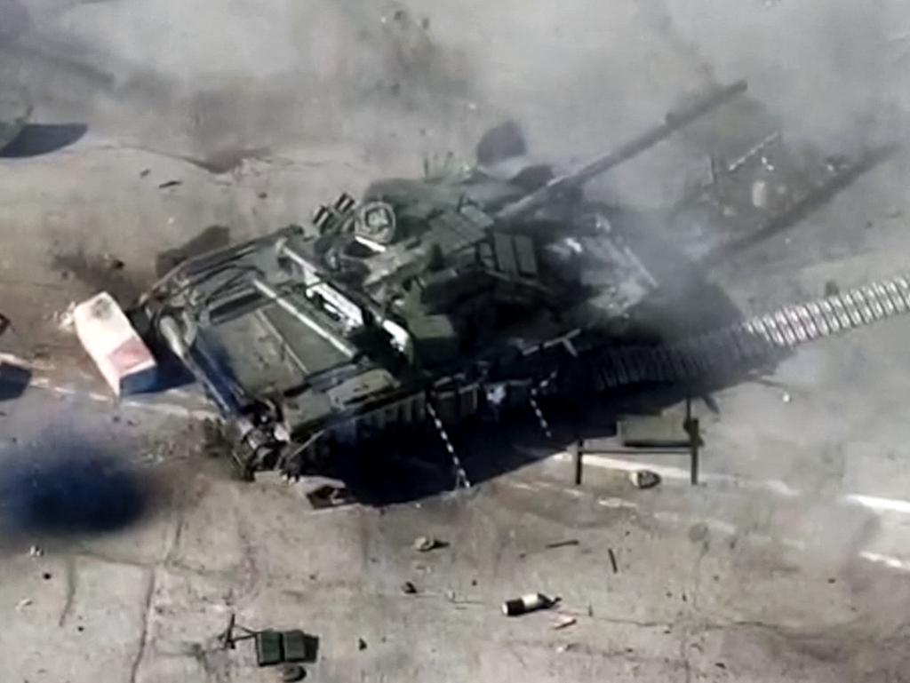 This grab taken from a handout footage released by the Russian Defence Ministry on March 12, 2024 reportedly shows a destroyed military vehicle of the Ukrainian troops in the border area between Russia and Ukraine in the Belgorod region. According to the ministry statement, sabotage and reconnaissance groups of Ukrainian forces were destroyed at the Nekhoteyevka border crossing. Pro-Ukrainian militias staged a brazen cross-border raid on Tuesday, claiming to take control of a Russian village, as Kyiv launched one of its largest drone attacks since the start of the war. Groups of pro-Kyiv volunteer fighters, made up of Russians who oppose the Kremlin, said that they had broken into the Kursk and Belgorod regions, while Moscow said it had fired rockets and artillery to foil the attempted incursion. (Photo by Handout / Russian Defence Ministry / AFP) / RESTRICTED TO EDITORIAL USE - MANDATORY CREDIT "AFP PHOTO / Russian Defence Ministry / handout" - NO MARKETING NO ADVERTISING CAMPAIGNS - DISTRIBUTED AS A SERVICE TO CLIENTS