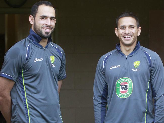 Leg-spinner Fawad Ahmed (left), with batsman Usman Khawaja, has declined to wear alcohol sponsor logos for religious reasons. Picture: Jonathon Searle