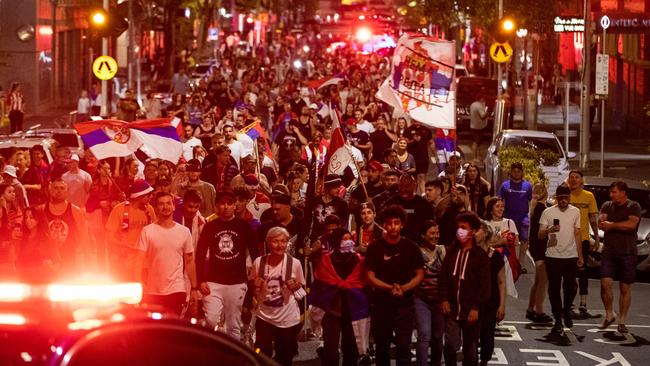 Serbian tennis fans marching on Collins St on Monday. Picture: Getty Images