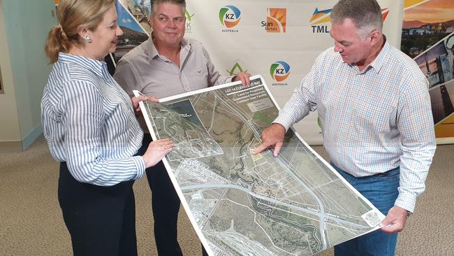 Townsville MP Scott Stewart, with Annastacia Palaszczuk and Thuringowa MP Aaron Harper, points to the location of the government's planned critical minerals facility in Stuart.