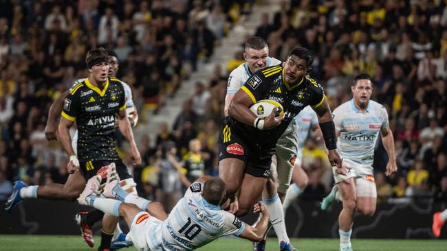 La Rochelle's Australian lock Will Skelton is tackled during the French Top14 rugby union match between Stade Rochelais (La Rochelle) and Racing 92 at The Marcel-Deflandre Stadium in La Rochelle, western France on June 8, 2024. (Photo by XAVIER LEOTY / AFP)