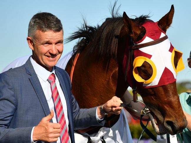 Trainer Matthew Smith poses with Fierce Impact after winning in race 9, the Lamaro's Hotel Sth Melbourne Toorak Handicap, during the Caulfield Guineas Day at Caulfield Racecourse in Melbourne, Saturday, October 12, 2019. (AAP Image/Vince Caligiuri) NO ARCHIVING, EDITORIAL USE ONLY