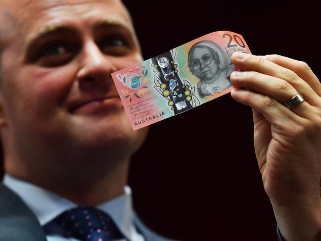 Australians are still going to want to hold some bank notes in their wallet or purse just in case. Picture: AAP