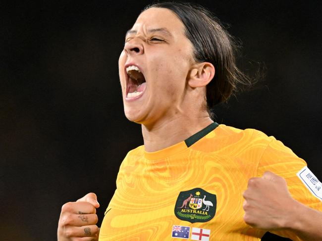 FILES-- This file photo taken on August 16, 2023 shows Australia's forward Sam Kerr celebrating scoring her team's first goal during the Australia and New Zealand 2023 Women's World Cup semi-final football match between Australia and England at Stadium Australia in Sydney. Chelsea and Australian women's football star Sam Kerr has been charged with a "racially aggravated offence" in Britain following a dispute involving a police officer, London's Metropolitan Police said March 4. The 30-year-old striker, one of the highest profile and best-paid players in the women's game, was charged following an incident in London in January 2023, a police statement read. (Photo by IZHAR KHAN / AFP)
