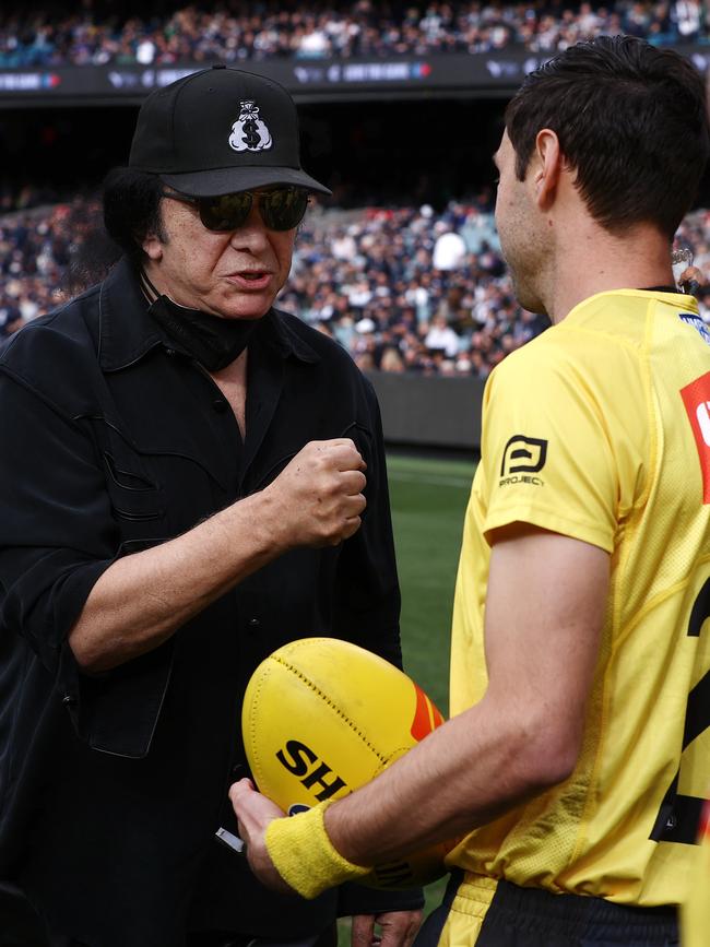 Carlton Blues fan Gene Simmons presents the match-day ball for the clash against the Collingwood Magpies at the MCG. Picture: Michael Klein