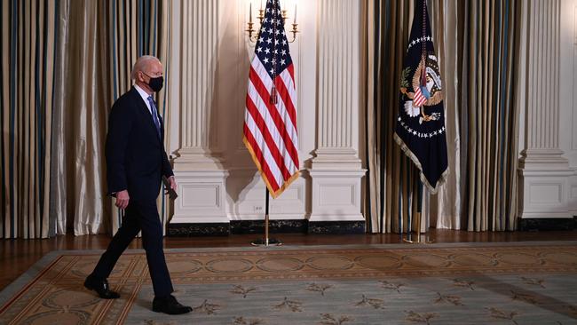 US President Joe Biden arrives to swear in presidential appointees during a virtual ceremony in the Oval Office of the White House in Washington, DC, after being sworn in at the US Capitol on January 20, 2021. (Photo by Jim WATSON / AFP)