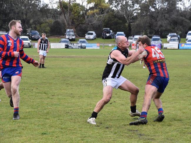 Steve Hamill tackles a Rye opponent.