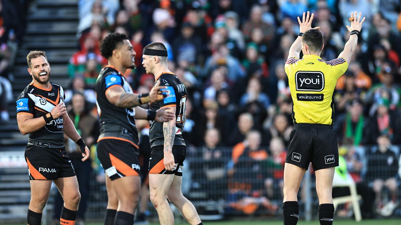 GOSFORD, AUSTRALIA – JULY 20: Aidan Sezer of the Tigers (L), is sent to the sin bin by referee Wyatt Raymond during the round 20 NRL match between South Sydney Rabbitohs and Wests Tigers at Industree Group Stadium, on July 20, 2024, in Gosford, Australia. (Photo by Mark Evans/Getty Images)