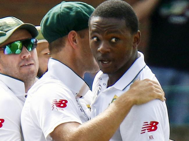 FILE - This is a Friday, March 9, 2018 file photo of  South Africa's bowler Kagiso Rabada, second right, with teammate celebrates after dismissing Australia's batsman Shaun Marsh, for 24 runs on the first day of the second cricket test match between South Africa and Australia at St George's Park in Port Elizabeth, South Africa. Rabada has been banned for the rest of the series against Australia after being found guilty of two charges of misconduct for aggressive wicket celebrations in the second test in Port Elizabeth. Rabadaâ€™s first offense, of intentionally bumping into Australia captain Steve Smith after dismissing him in the first innings, earned the young quick three demerit points. Those disciplinary points took him over a threshold, leading to a two-test ban. (AP Photo/Michael Sheehan/ File)