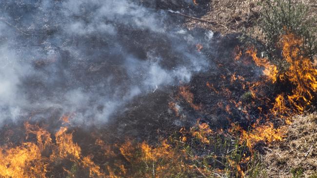 A car fire that escaped onto grassland took almost an hour to put out at Kybong yesterday afternoon. File photo.