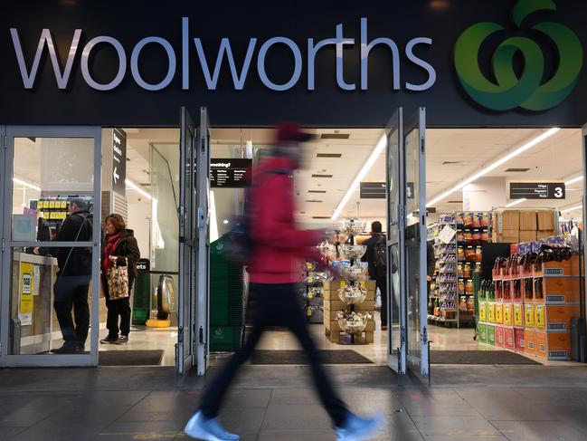 Shoppers walk past a Woolworths store in Sydney, Monday, August 20, 2018. Woolworths Group will hand down it's full year results today. (AAP Image/Dean Lewins) NO ARCHIVING