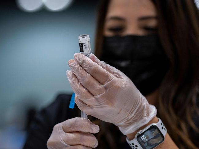 A health worker prepares a dose of the Johnson &amp; Johnson COVID-19 vaccine. Picture: AFP